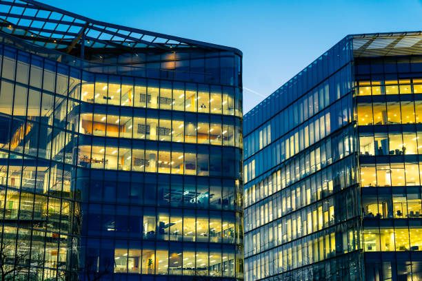 istock Illuminated office buildings in London at Night 1945288704