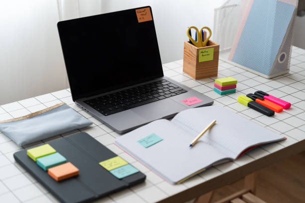 istock Laptop Computer Sitting on Top of Desk 1945363075