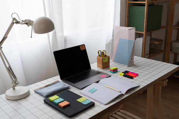 istock Laptop Computer Sitting on Top of Desk 1945363081