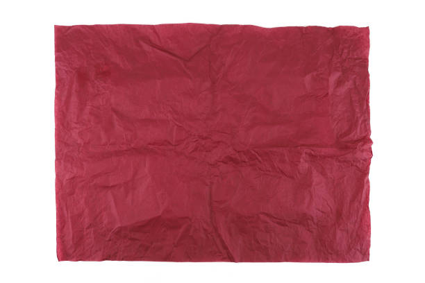 istock Burgundy wrapping paper sheet isolated on white background. 1945370403