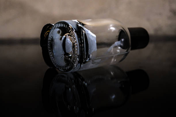 reflection of a glass bottle lying in low light