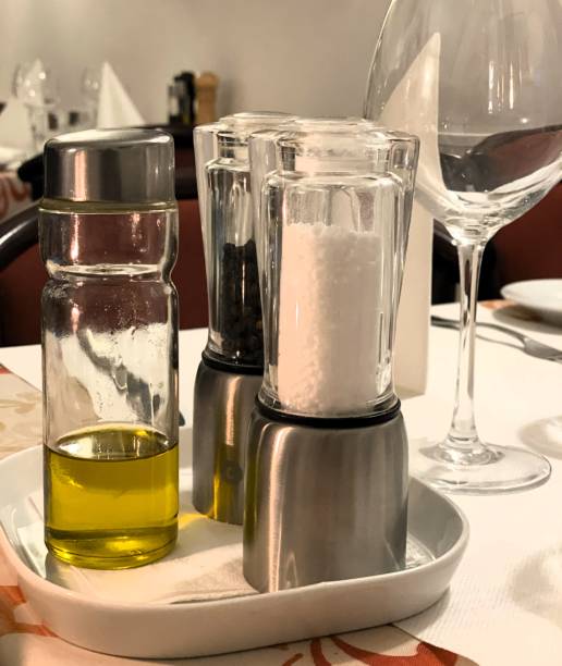 Olive oil, salt and pepper arranged on a tray in Italian restaurent in Scandinavia