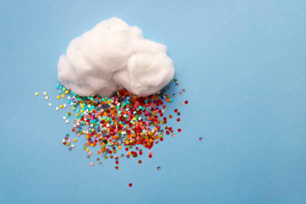 istock White cloud with colorful rain of hearts 1945450330