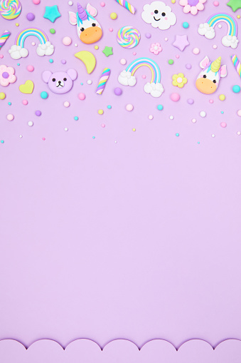 Trendy pastel purple kawaii banner background design template with cute air plasticine handmade cartoon animals, unicorns, stars, rainbows pattern. Top view, flat lay, copy space. Candycore, fairycore