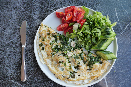 top view of herb Egg Omelette on table .