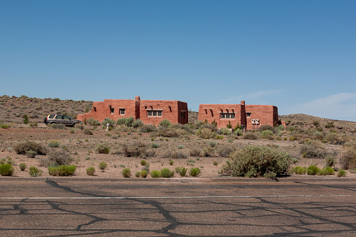 Painted Desert Inn, a historic landmark in Arizona, showcasing its architectural beauty, rustic charm, and cultural significance. The vintage adobe construction, blending seamlessly with the desert landscape, provides a glimpse into the architectural history and historic preservation efforts, inviting visitors to experience the timeless beauty and cultural treasures of this iconic Southwestern inn.