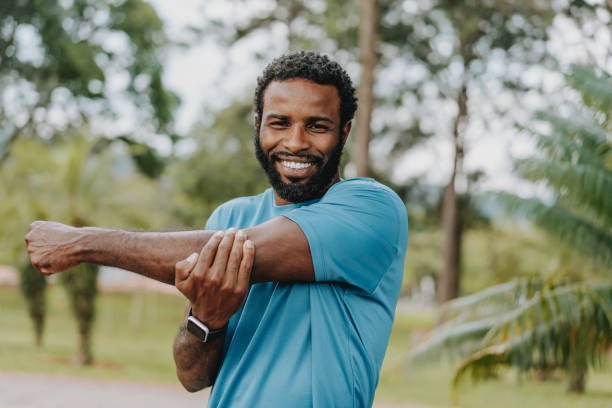 istock Portrait of a man stretching to do physical exercise 1945477927