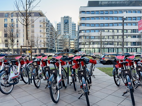 Frankfurt, Germany, 01.09.2023 - Bicycles of a bike sharing system parked on a sidewalk, waiting for customers in Frankfurt city centre