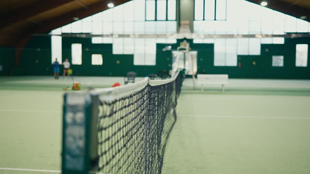 SLO MO Tennis Net on Green Court with Covered Shed in Sports Club