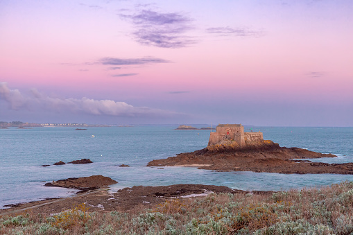 Fort National and beach in beautiful walled port city of Saint-Malo at sunrise, Brittany, France
