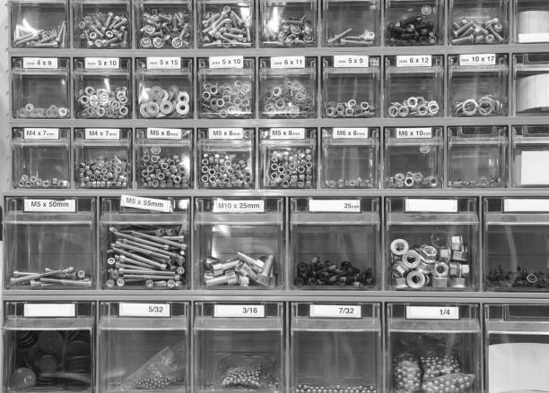 shelf with bolts and nuts for repairs and maintenance in the repairmans shop