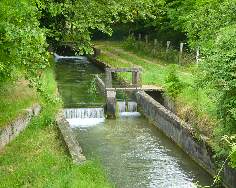 detail of the small bulkhead to divert the watercourse of the ditch for the irrigation of cultivated fields during the summer season