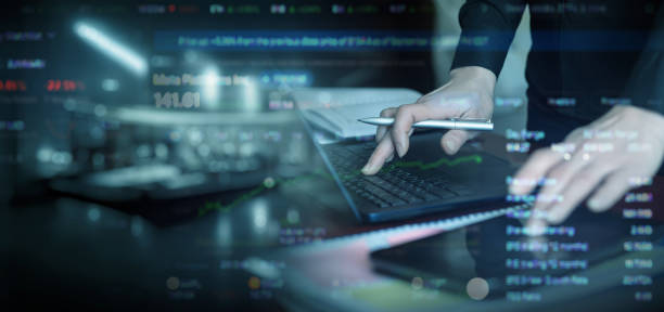 istock Business manager working on mobile devices in trading. 1945524715