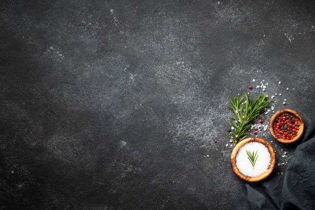 istock Spices and herbs at black top view. 1945540578