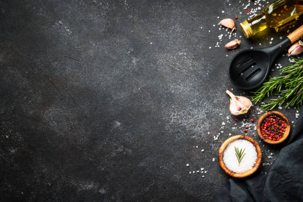 istock Spices and herbs at black top view. 1945542590