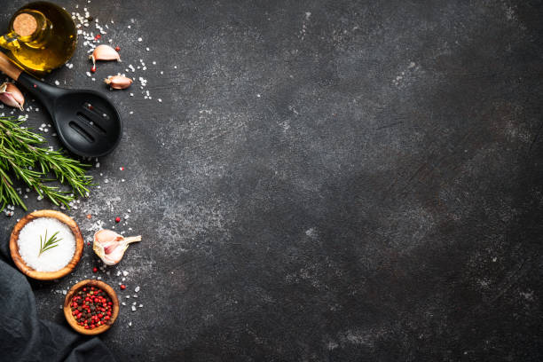 istock Spices and herbs at black top view. 1945543113