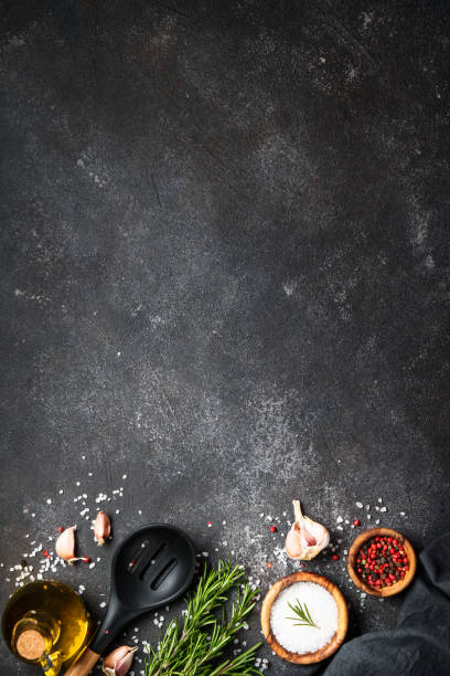 istock Spices and herbs at black top view. 1945544696