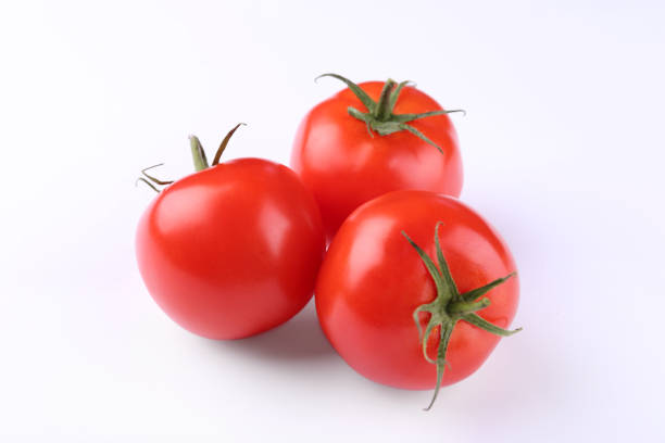 istock Fresh ripe red tomatoes on white background 1945650345