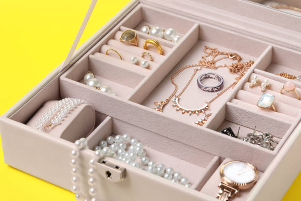 istock Jewelry box with many different accessories on yellow background, closeup 1945705304