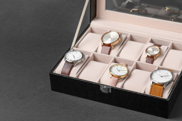 istock Jewelry box with many different wristwatches on dark gray background, space for text 1945705919