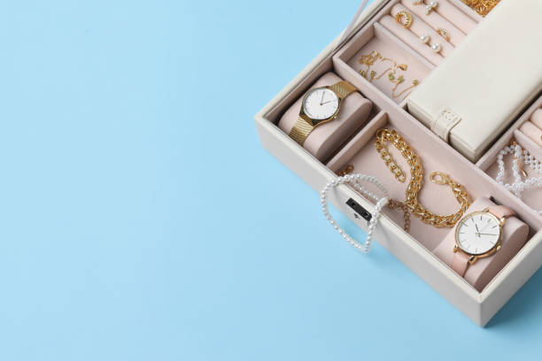 istock Jewelry box with many different accessories on light blue background, above view. Space for text 1945706972