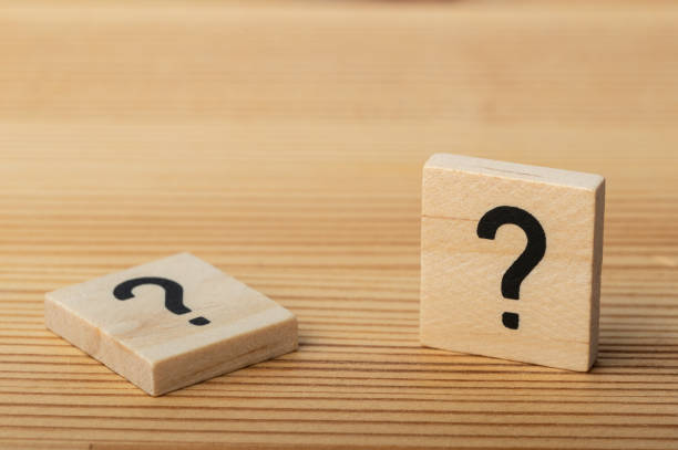 istock Wooden question mark tiles on a desk 1945787866