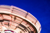 long exposure photograph of a chain carrousel at night