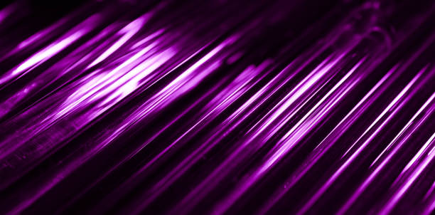 istock glowing optical violet fiber in the dark 1945819202