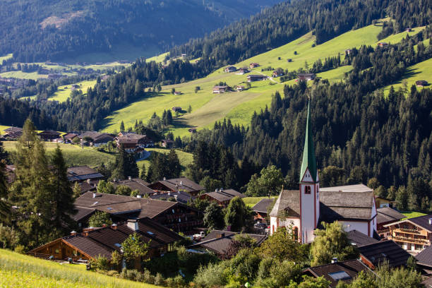 Village Alpbach in Austria at summer day. Traditional architecture, amazing environment in valley on European apls. Tyrol region, Austria, Europe.