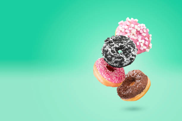 istock Delicious donut on color background 1945877792