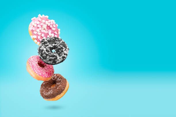 istock Delicious donut on color background 1945878322