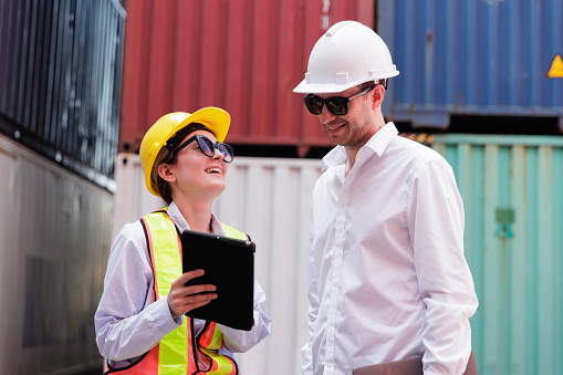 Manager and foreman discuss at cargo container terminal