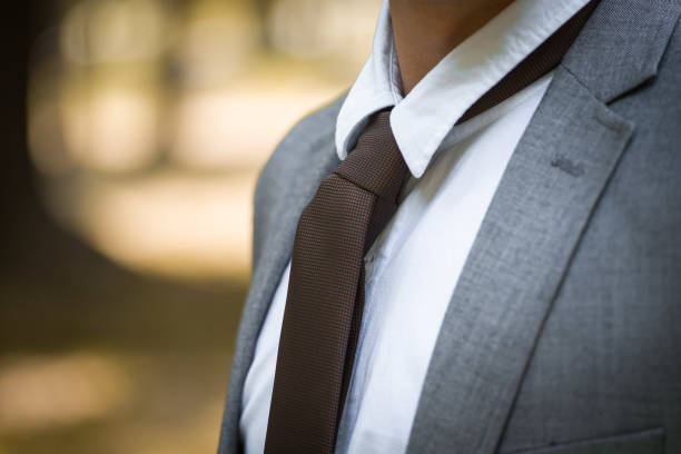 istock Unrecognizable young businessman in formal clothes adjusting his necktie 1945924369