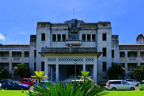 Suva, Rewa Province, Central Division, Viti Levu island, Fiji: the Art Deco Government Buildings compound, designed by the Chief Colonial Architect, Walter Frederick Hedges and completed in 1939 - Victoria Parade side, housing the High Court. The Fijian High Court has jurisdiction to hear and determine any civil or criminal proceedings under any law and such other original jurisdiction as is conferred on it under the Constitution.