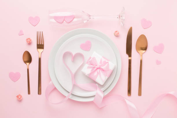 istock Festive table setting for Valentine's Day on color background, top view 1946004917