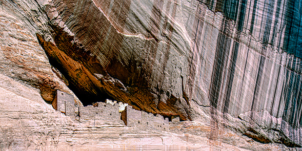 This unique image captures the famous White House in Canyon de Chelly in a sepia tone.  The stained varnish adds to the visual strength as the lines of varnish seems to accent the height of the canyon wall.