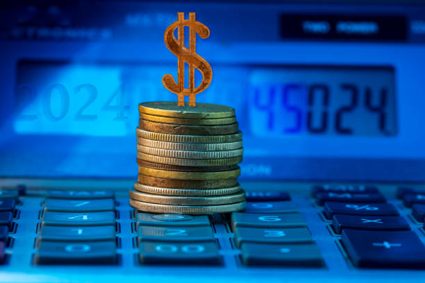 dollar symbol with coins and calculator