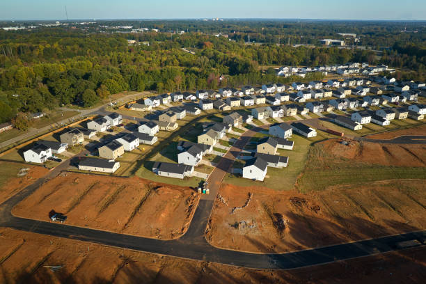 ground prepared for building of new residential houses in south carolina suburban development area. concept of growing american suburbs - basement blueprint real estate house 뉴스 사진 이미지