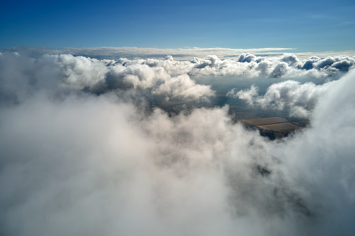 Panoramic view of the Kalahari desert with big puffy clouds