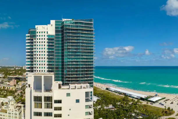 Photo of Popular vacation spot in the United States. Ocean warm waters and sandy beachfront at Miami Beach in Florida, USA. American travel destination