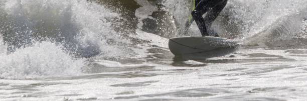 istock Man surfing a large wave close up 1946180588