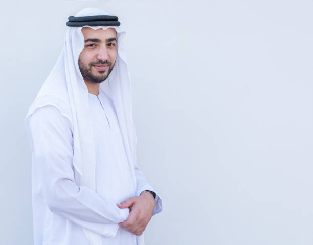 istock Arabic young man side standing in confident  way on white isolated background 1946230547