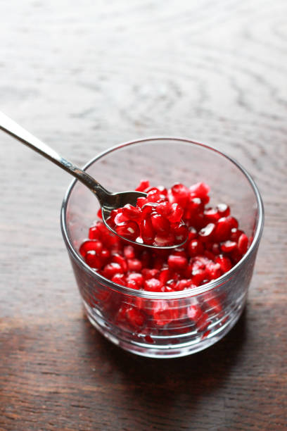 istock Pomegranate seeds in a glass bowl 1946242161