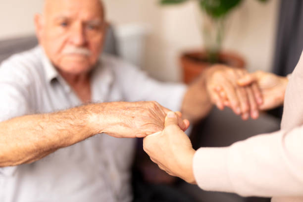 istock Close up hands of helping hands elderly home care. 1946247481
