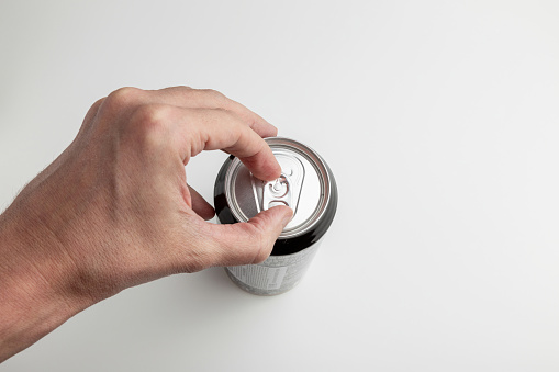 a Hand Skillfully Unsealing a Can