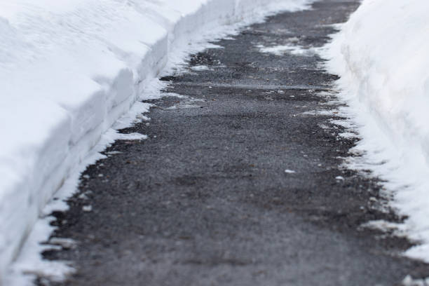 istock Winter road with salt for melting snow 1946272017