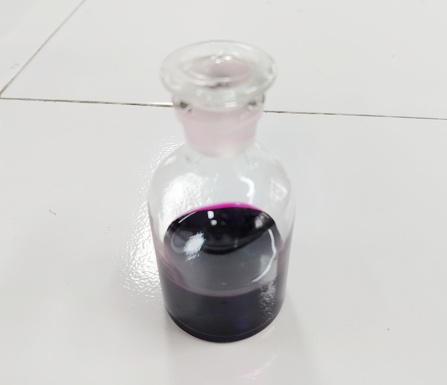 potassium permanganate solution in a glass bottle