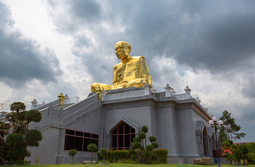 Monk statue Luang Pu Tim at wat lahan rai, rayong thailand.