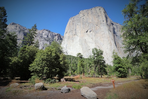 El Capitan is a world-famous location for rock climbing and big wall climbing, including free, aid, and free solo climbing. It is a vertical rock formation in Yosemite National Park in California. The granite monolith is approximately 3,000 feet from base to summit.