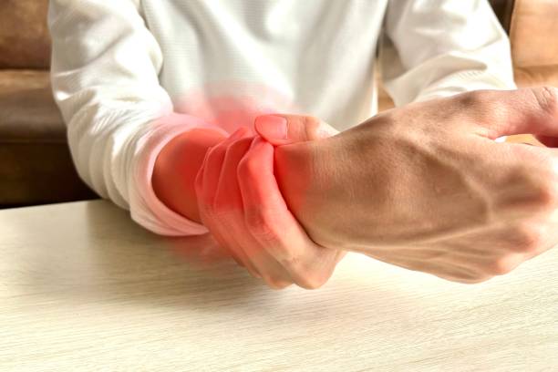 istock Man with arm pain 1946321746